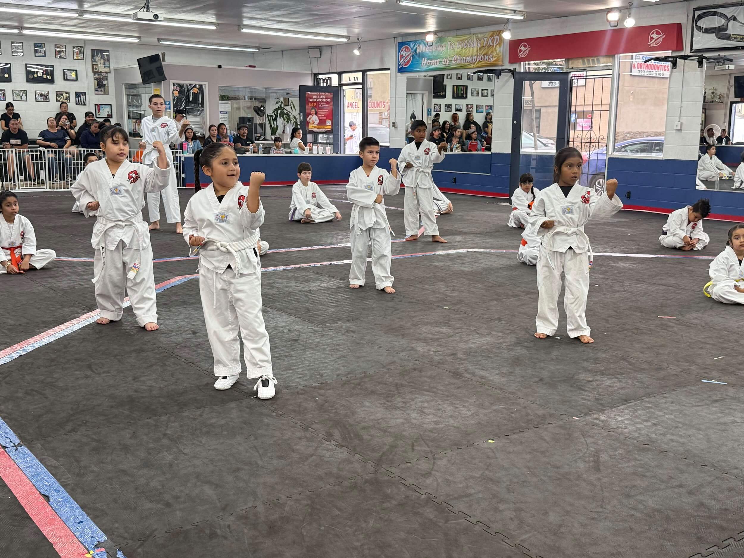 young Villa's Taekwondo students practicing techniques during class in Los Angeles