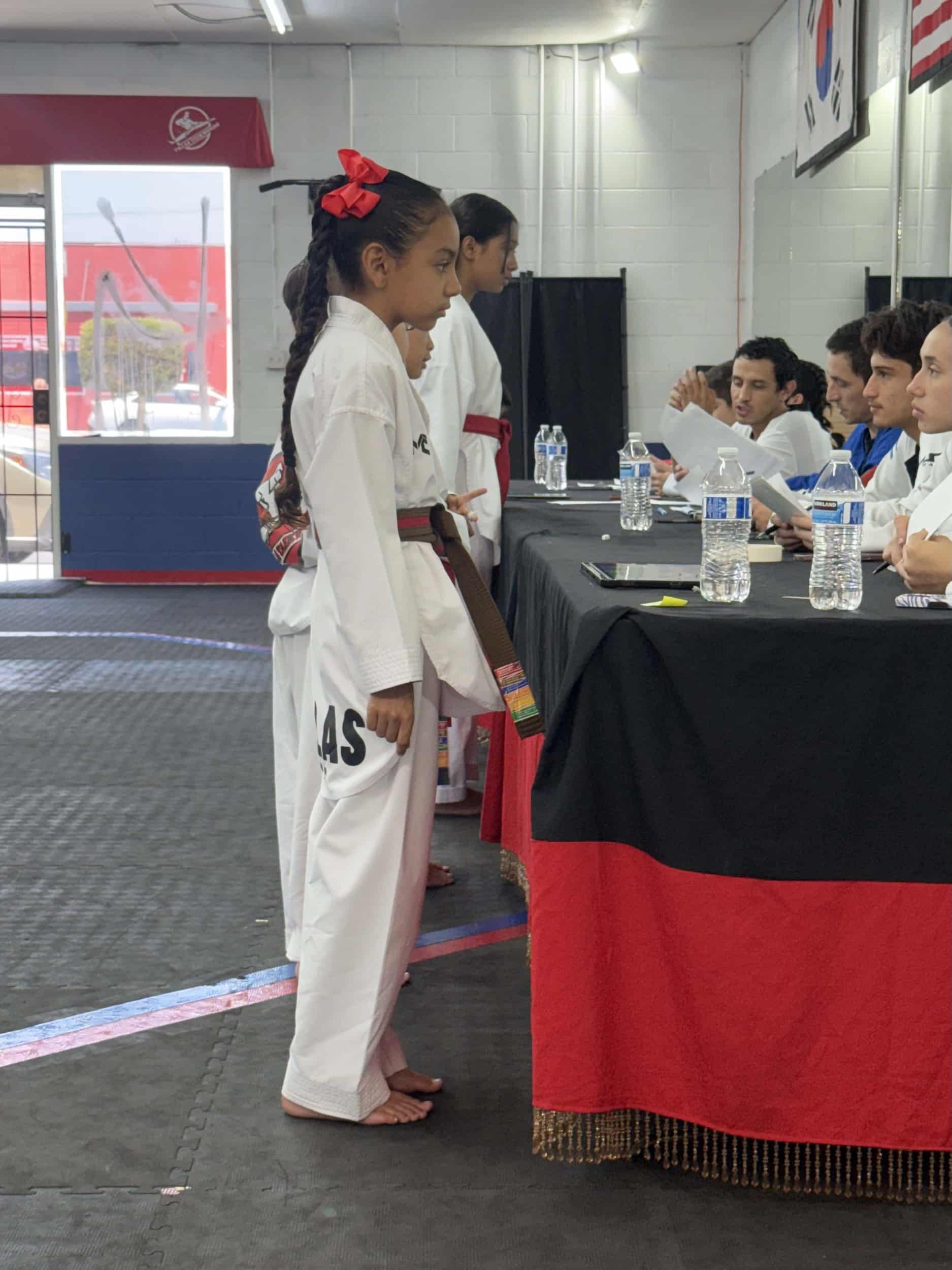 Villa's Taekwondo competition team signing up for competitions at table